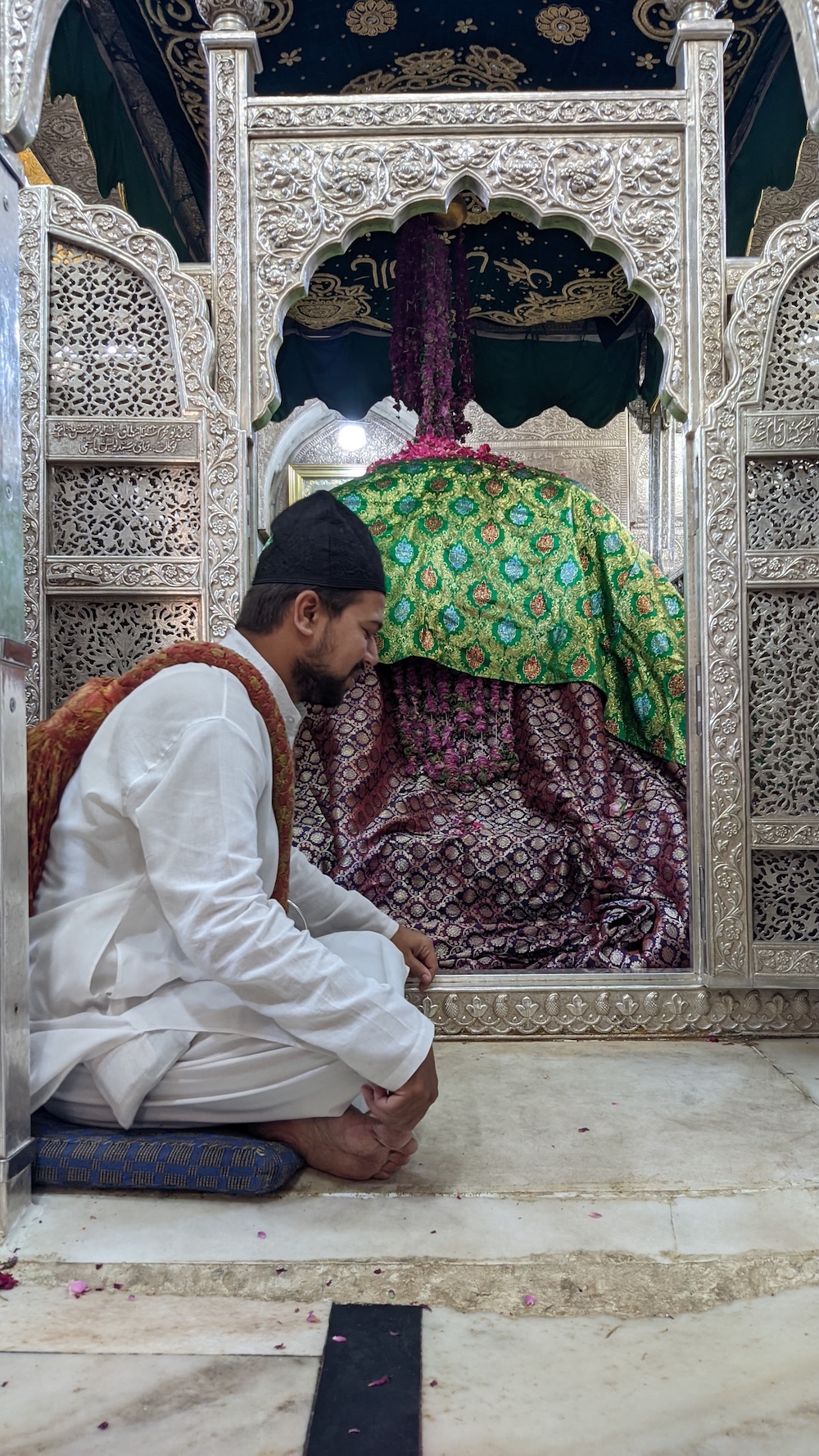 Beside the silver jaali of Khwaja Sahib